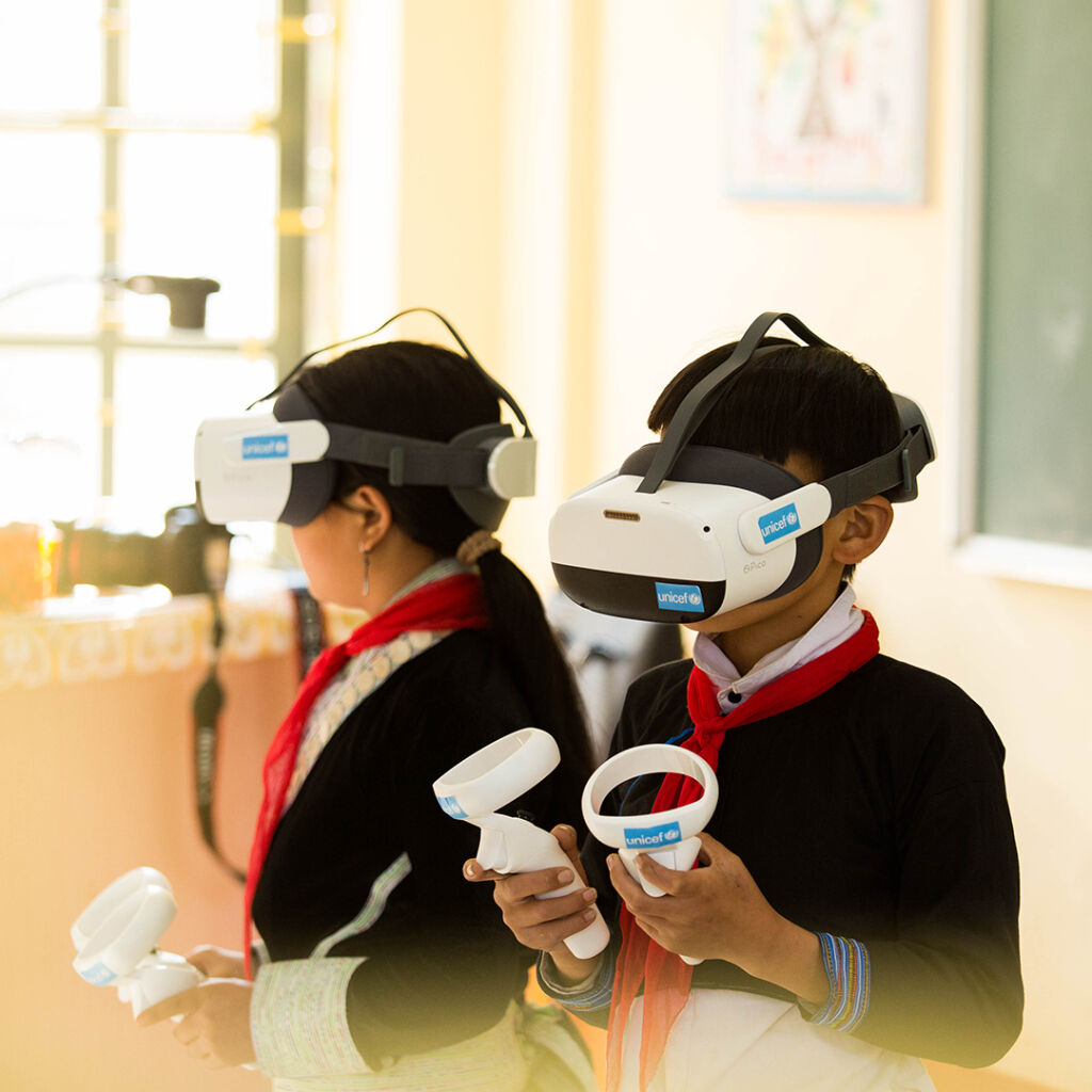 Pupils using VR goggles during class