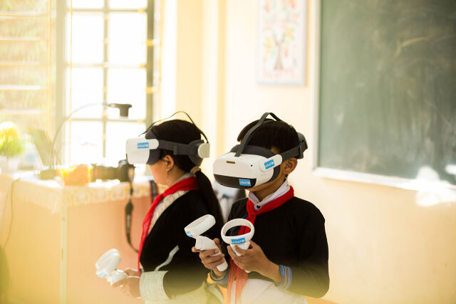 Pupils using VR goggles during class.